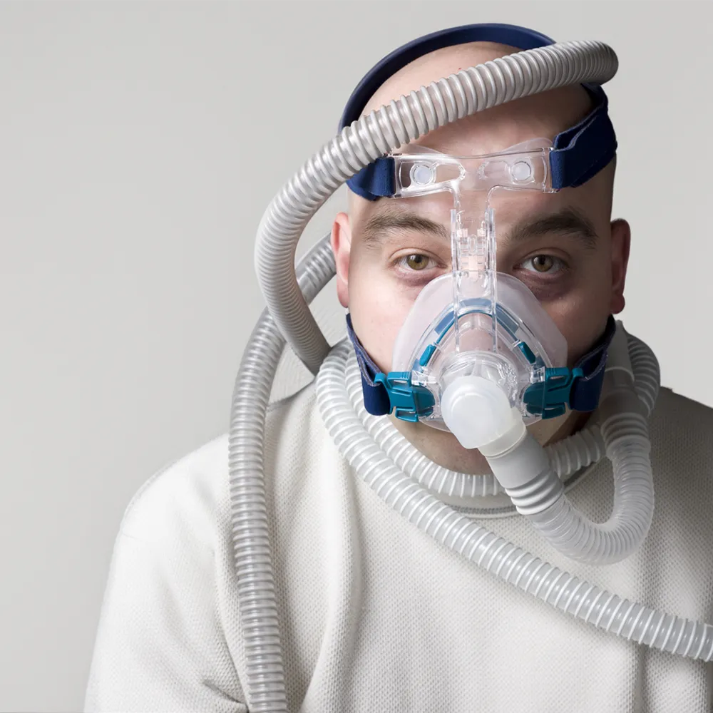 Man struggling with CPAP Man struggling with CPAP